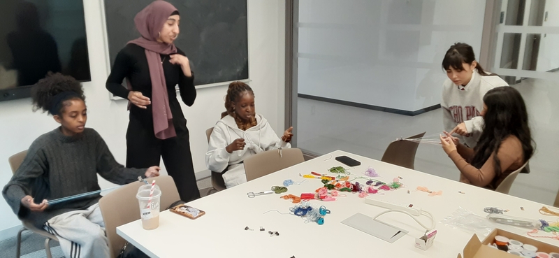 five students learning loop braiding