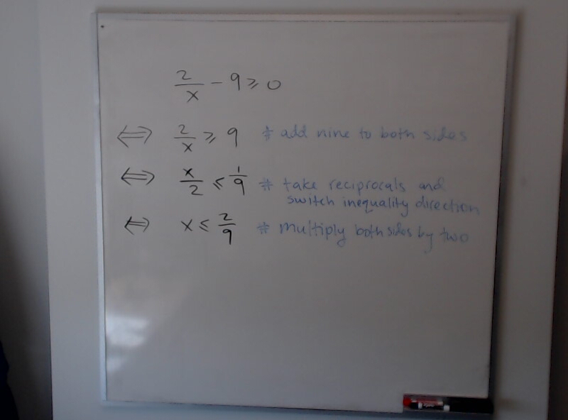 A photo of a whiteboard titled: Solving 2/x - 9 >= 0