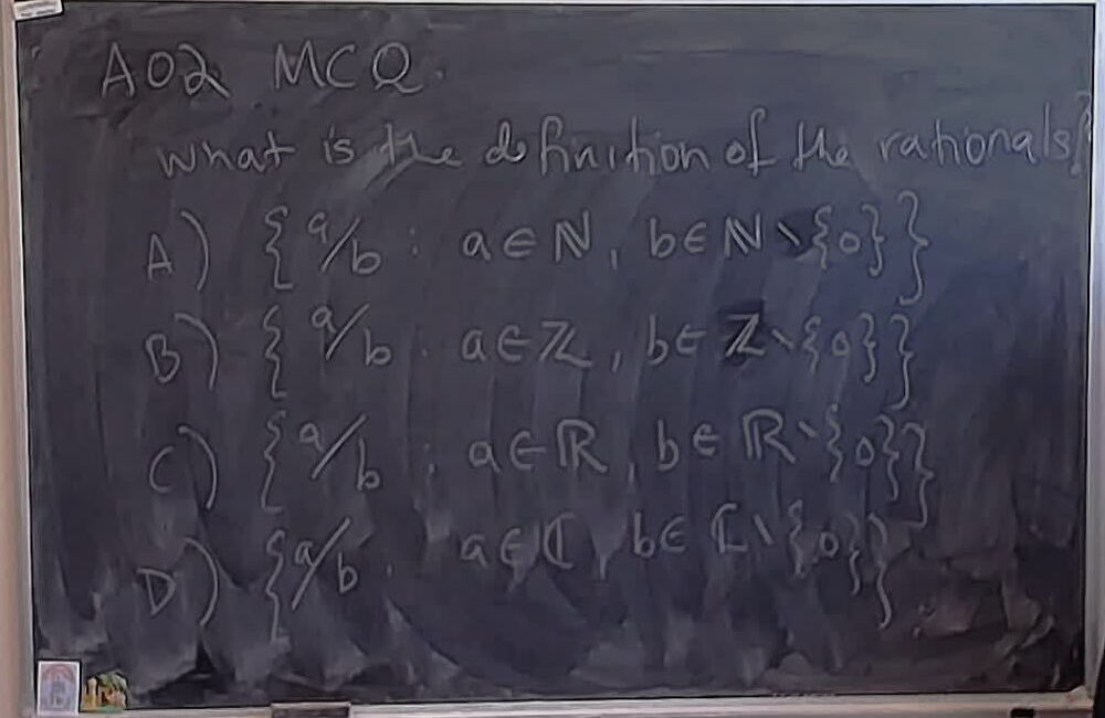 A photo of a whiteboard titled: A02 MCQ: Possible definitions of the naturals