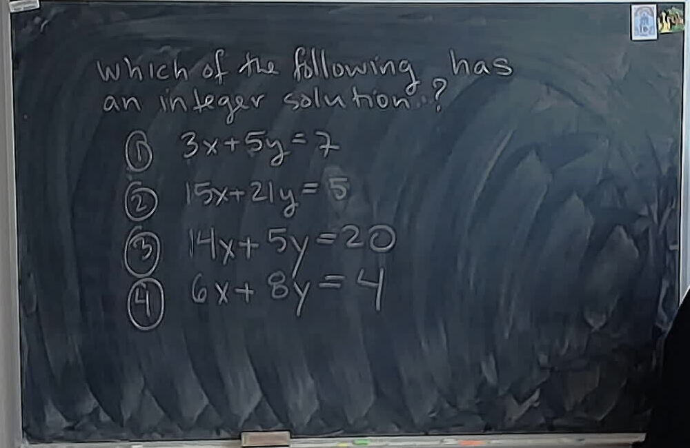 A photo of a whiteboard titled: A02 MCQ: Which Diophantine Equation Has a Solution?