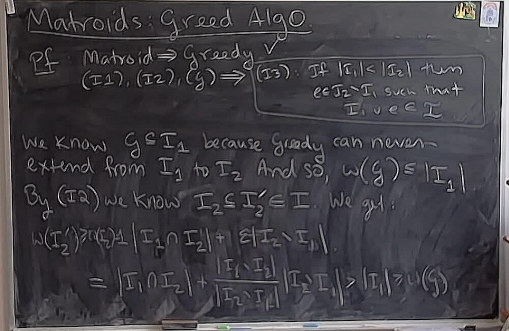 Matroids: Greedy Algorithm (Part 5) A photo of a whiteboard titled: Matroids: Greedy Algorithm (Part 5)